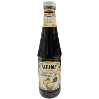 Bottle of Heinz Oyster Sauce showing the label and dark brown liquid inside a clear plastic bottle.