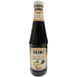 Bottle of Heinz Oyster Sauce showing the label and dark brown liquid inside a clear plastic bottle.