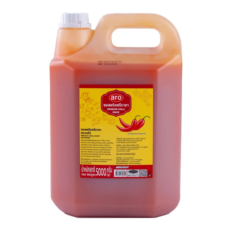 A 5kg container of ARO Sriracha Chili Sauce in a dry grocery setting, showing the large jar with bright red chili sauce inside.