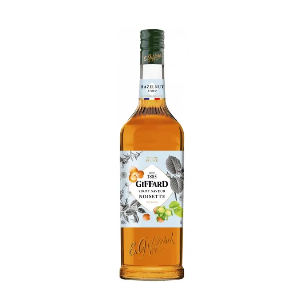 Giffard Barista Hazelnut 1L bottle, a dry grocery flavoring for coffee and desserts, with a clear label and dark liquid inside.