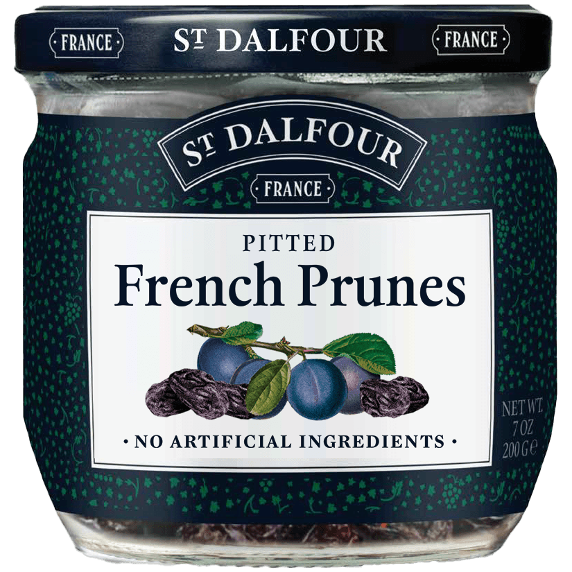 A close-up of a jar of St. Dalfour Prunes, ripe dark prunes in syrup, ready to be enjoyed as a nutritious snack or ingredient.