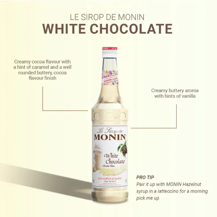 Monin White Chocolate Syrup 700ml bottle, ideal for coffee and desserts, with a white chocolate flavor and sleek label design.