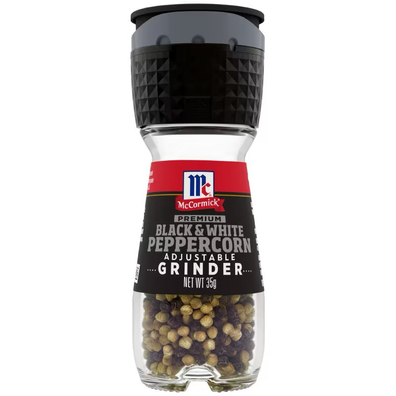 McCormick Black and White Grinder with salt and pepper shakers on a kitchen countertop
