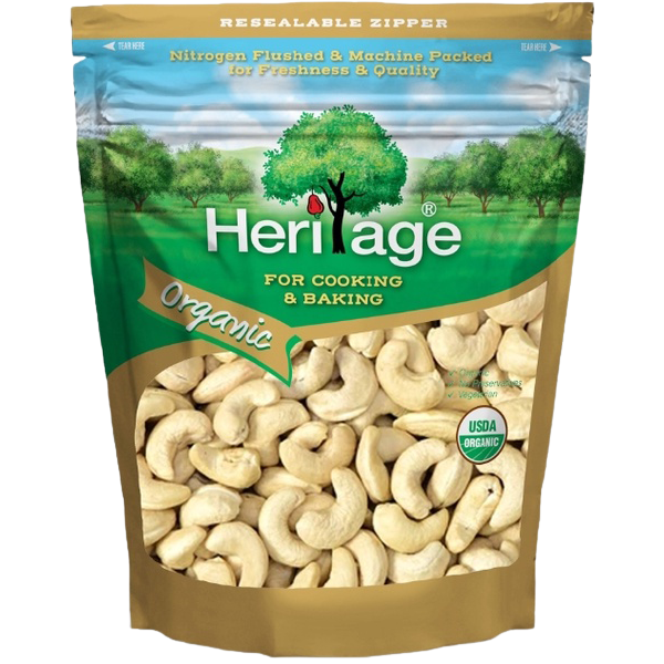 Heritage Organic Whole Cashew Nuts in a clear bowl, showcasing their creamy, natural color and crunchy texture for healthy snacking.