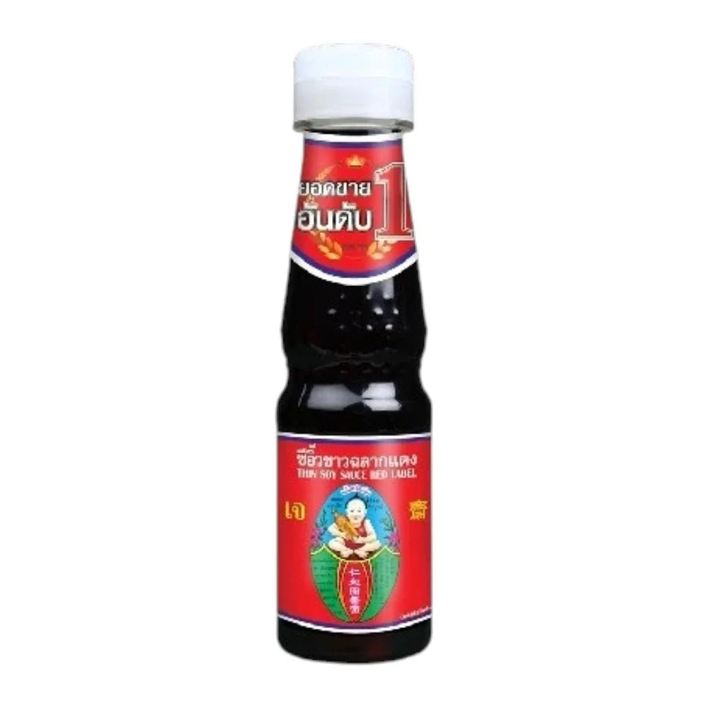 Deksomboon Thin Soy Sauce 140ml bottle, clear label, placed on a kitchen countertop, suitable for Asian cuisine cooking.