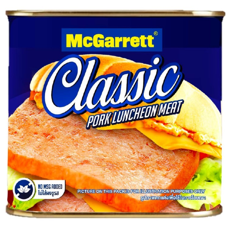 Canned McGarrett Pork Luncheon Meat in a can, ready for slicing and cooking, on a grocery store shelf.