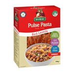 San Remo Red Lentils Spirals in a clear bowl, showcasing the bright red, spiral-shaped pasta on a white background.