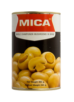 Fresh Mica Champignon mushrooms in a grocery setting, showcasing the white caps and stems of these edible fungi.