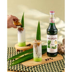 Monin Pandan Syrup 700ml bottle in a clear plastic container, used in cooking and beverages, from Monin dry grocery collection.