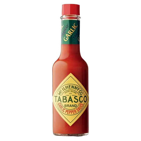 Tabasco Garlic Pepper Sauce bottle, hot sauce with garlic flavor, for adding spice to dishes in a grocery setting.