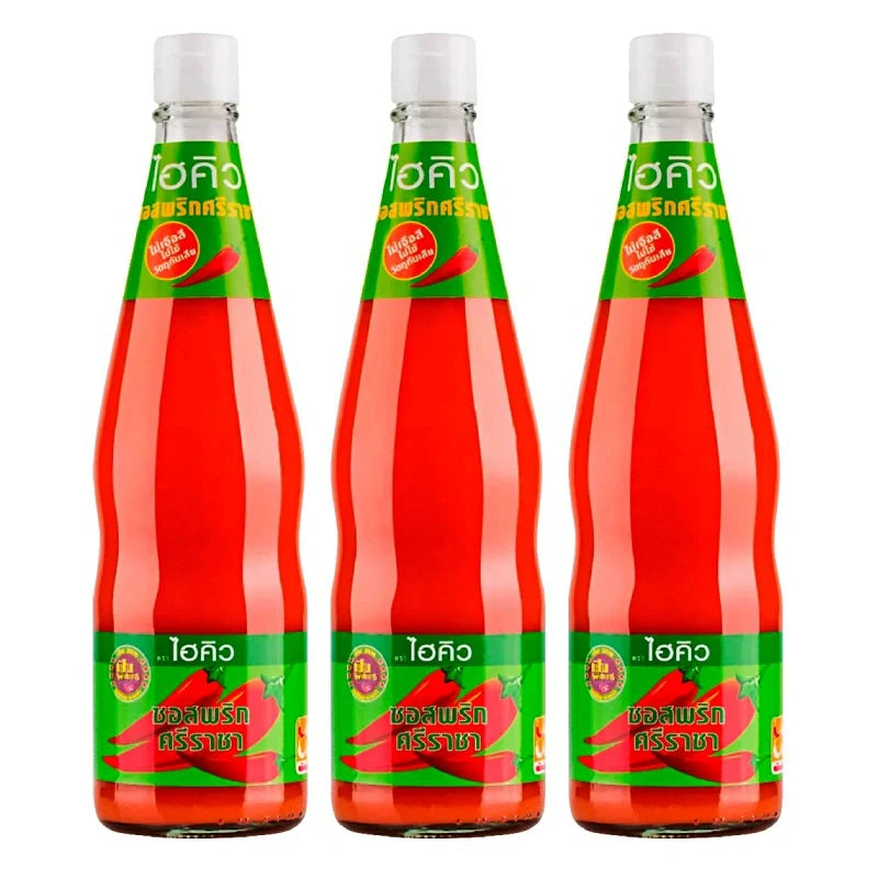 Three bottles of HI-Q Siracha Chili Sauce in 670g bottles, shown in a close-up image for dry grocery shopping.