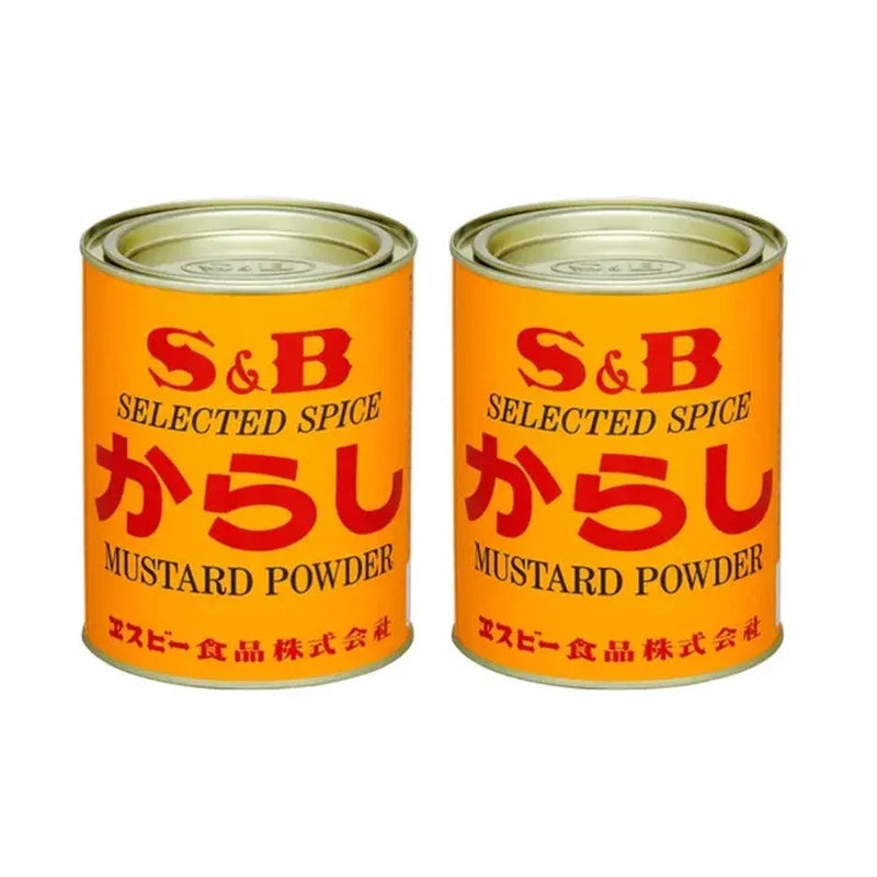 S & B Selected Spice Mustard Powder and Turmeric cans, dry grocery spices for cooking, in metal canisters with colorful labels.
