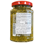 Mutti Green Tomato Pesto jar with fresh basil and green tomatoes, highlighting the vibrant ingredients and packaging.