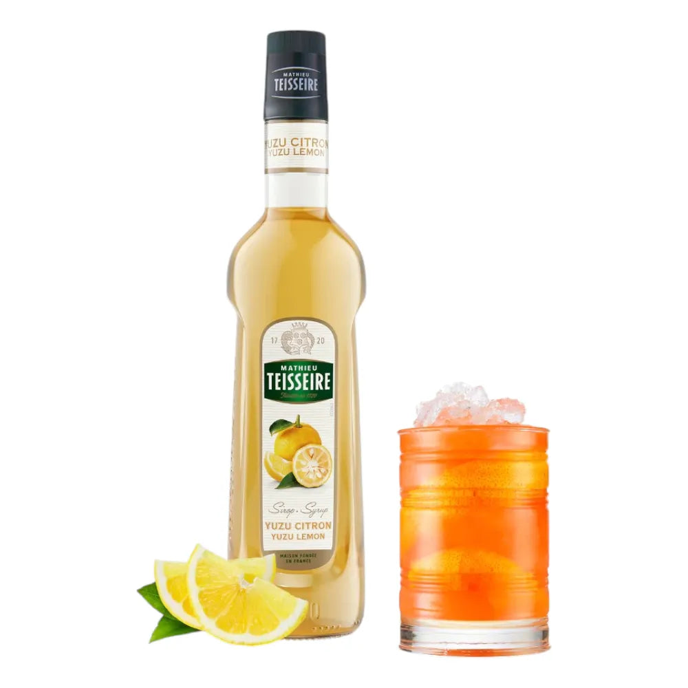 Mathieu Teisseire Yuzu Syrup 700ml bottle, dry grocery product with yellow and green label, for flavoring beverages and cooking.