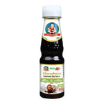 Deksomboon mushroom soy sauce less sodium in 150ml bottle, traditional Asian dry grocery ingredient with rich mushroom flavor.