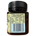 Jar of Kiwi Reserve NZ Monofloral Manuka Honey MGO 525+ with golden honey color and label showing product and brand details.