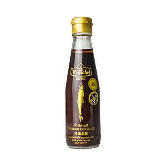 Bottle of Megachef Fish Sauce in a clear glass container with a label, used as a flavorful ingredient in cooking.