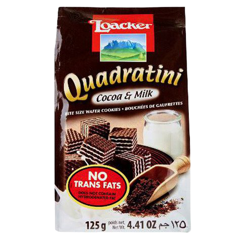 Loacker Quadratini Cocoa Milk wafer cookies in a clear container, showcasing the bite-sized chocolate and milk-flavored wafer snacks.
