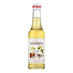 Bottle of Monin Vanilla Syrup 250ml for drinks and desserts, featuring a clear label and dark syrup inside.