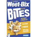 Sanitarium Weet Bix Bites Crunchy Honey breakfast cereal in a bowl with visible honey-coated, golden-brown cereal pieces.