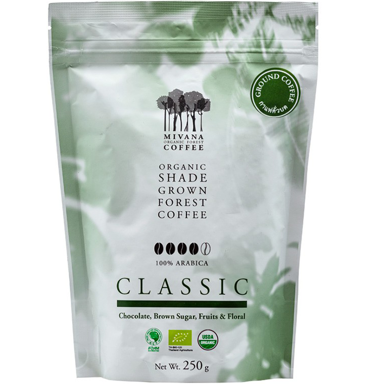 Mivana Organic Arabica ground coffee in a glass jar, showing the coffee grounds and label on the packaging.