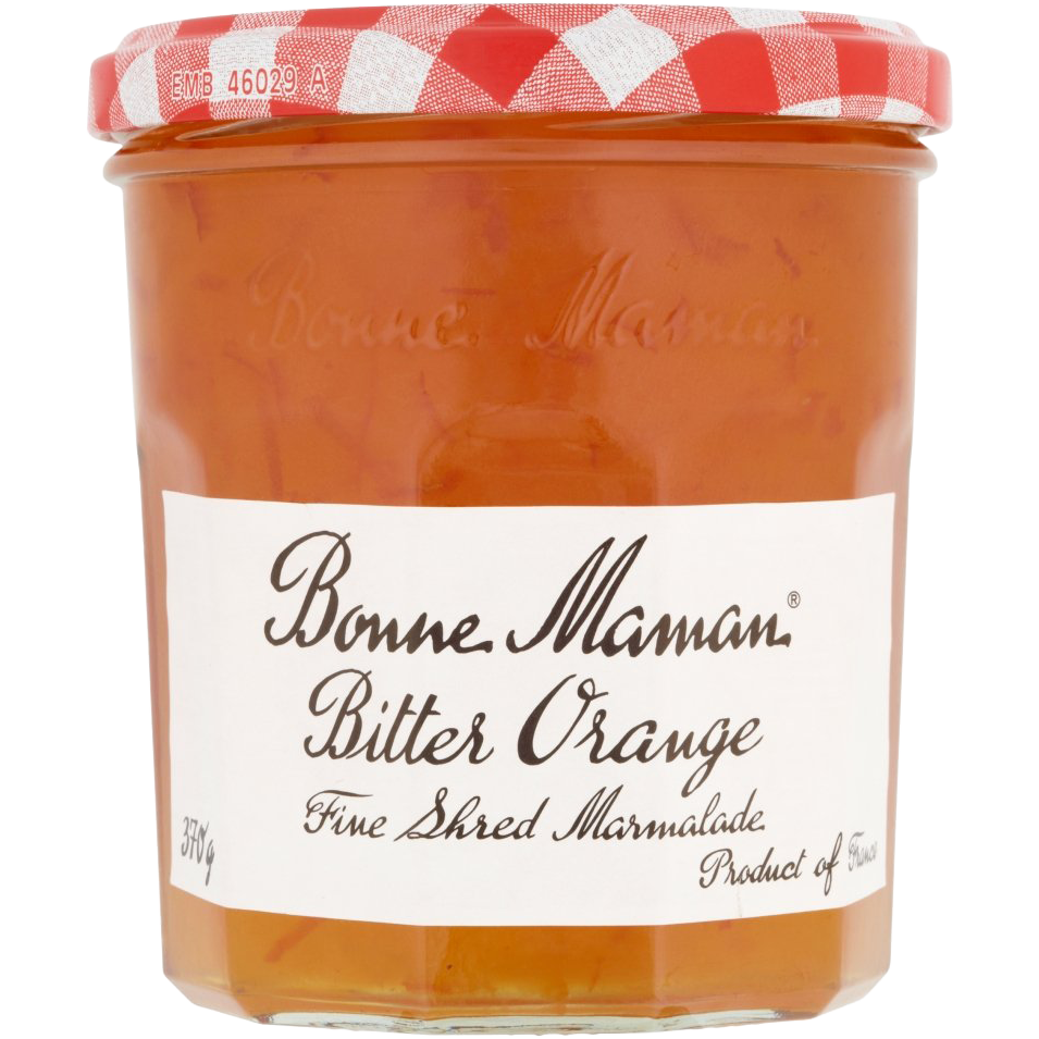 Jar of Bonne Maman Bitter Orange Marmalade with orange slices and spread on a toast slice. Bright, citrusy breakfast spread.