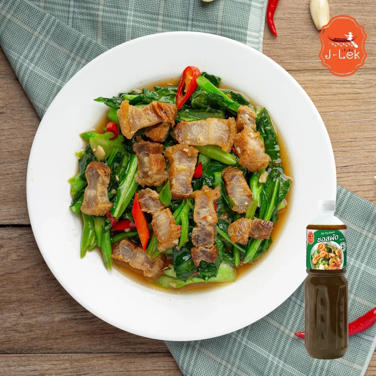 J-lek Stir-fry Sauce bottles 550g in clear plastic bottles, labeled with brand and product name, suitable for cooking and seasoning