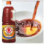 HIGASHIMARU Usukuchi Shoyu soy sauce bottles, 1.8L each, in a dry grocery setting, showing clear label and dark soy liquid