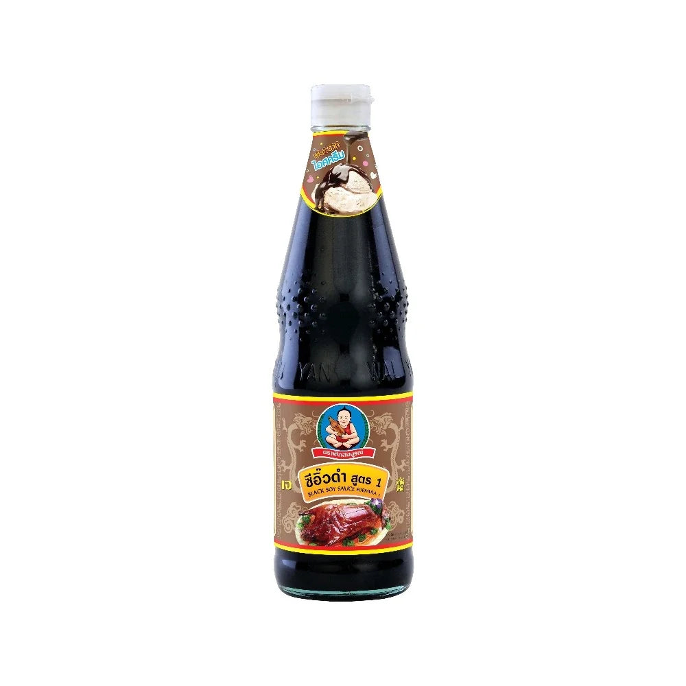 Deksomboon Black Soy Sauce 970g bottle from the dry grocery section, showing the dark soy sauce in a clear plastic bottle.