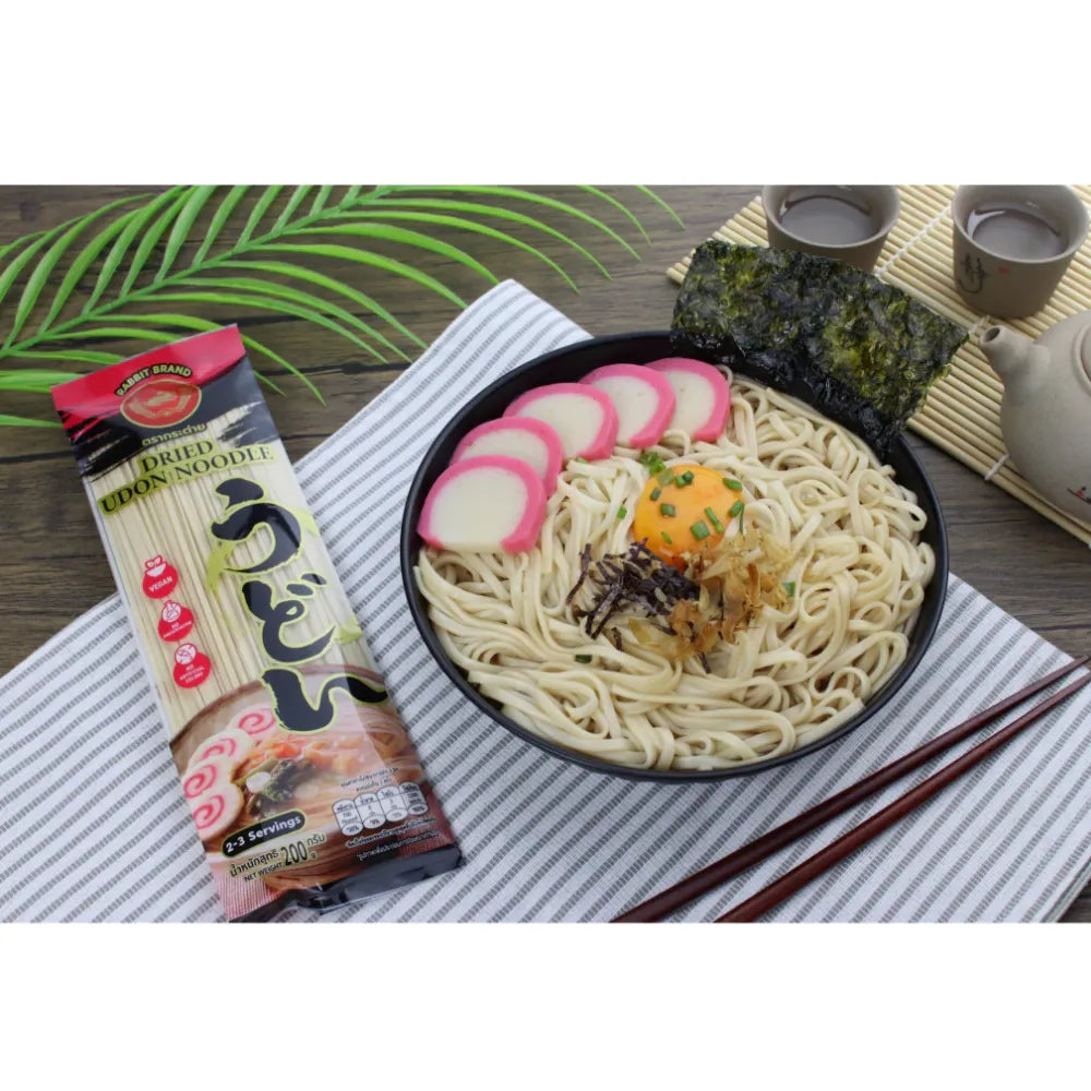Rabbit Brand Udon Noodles 200g, dry Japanese-style wheat noodles in a sealed package, suitable for cooking and Asian recipes.