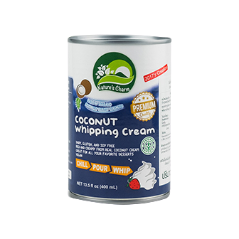 Cream of Nature's Charm Coconut Whipping Cream in a jar, showcasing its creamy texture for healthy cooking and baking.