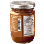 Jar of Paweenee's chocolate nut butter with a smooth, creamy texture and chocolate swirls, perfect for spreading or snacking.