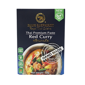 Blue Elephant Red Curry Paste in a jar, vibrant red color, Thai grocery product made for authentic cooking.
