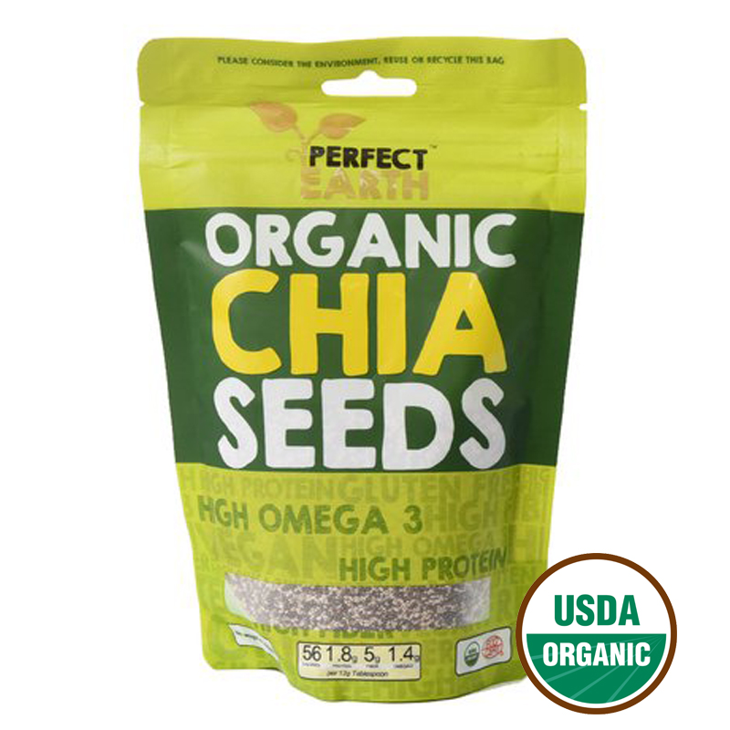 Organic chia seeds in a clear glass jar from Perfect Earth, showcasing their small, black and white seeds for healthy snacking.