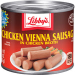 Cans of Libby's Chicken Vienna Sausages in a grocery store, showing the product label with chicken sausage images and branding.