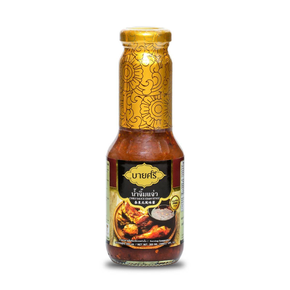 Bysri Esan Style Chili Sauce bottle, bright red sauce with chili peppers, on a grocery store shelf.