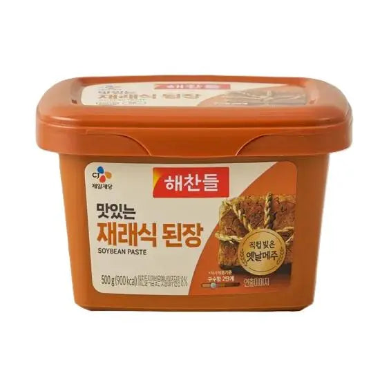 HaeChandle Doenjang in 500g jar, traditional Korean fermented soybean paste, shown in a close-up shot.