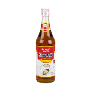 Bottle of Oyster Fish Sauce Red from Oyster brand, showing the label and clear glass container used for cooking and seasoning.