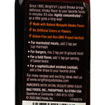 Wright Mesquite Liquid Smoke in a clear bottle, used for adding smoky flavor to grilled and smoked dishes.
