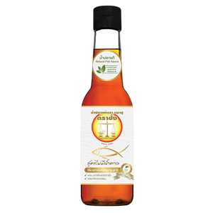 Bottle of Trachang Fish Sauce No Sugar for cooking and seasoning, with clear label showing brand and product details.