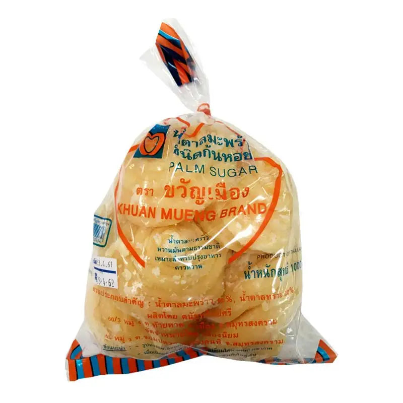 Khuan Mueng coconut palm sugar in spiral shape, 1kg, dry grocery product from KHUAN MUENG with a close-up view of the sugar pieces.