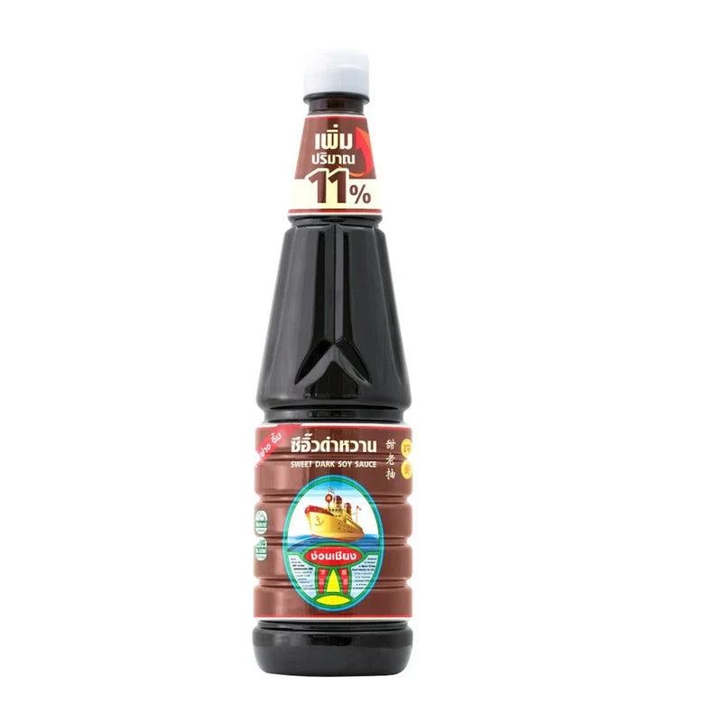 Nguan Chiang Sweet Dark Soy Sauce 950g bottle in dry grocery aisle, showcasing the label and dark color of the soy sauce