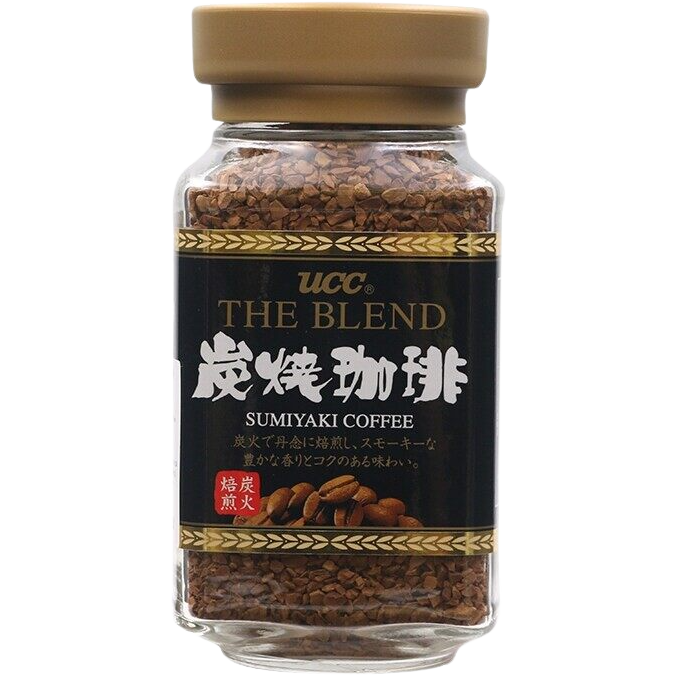 Ucc Sumiyaki Coffee drink in a clear glass, showcasing dark roasted coffee with a rich, smoky appearance.