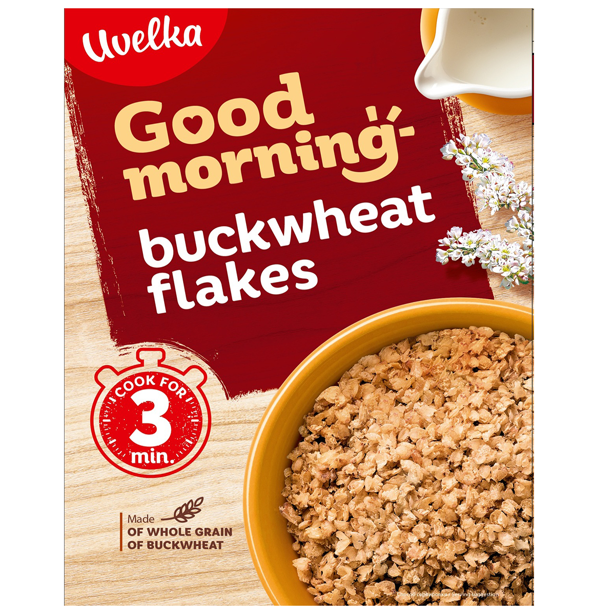 Uvelka Buckwheat Flakes in a clear bowl, showing roasted, golden-brown buckwheat cereal for healthy breakfast or cooking.