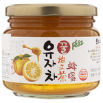 Feliz Honey Citron Tea jar from grocery aisle, showing label with honey and citron ingredients, in a clear glass container.
