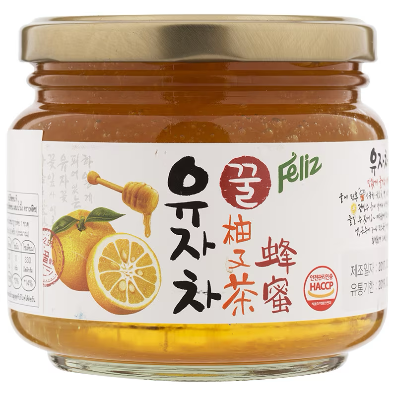 Feliz Honey Citron Tea jar from grocery aisle, showing label with honey and citron ingredients, in a clear glass container.