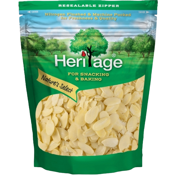 Sliced Heritage Almond confectionery snacks in a clear bowl, showcasing golden almond slices ready to enjoy.