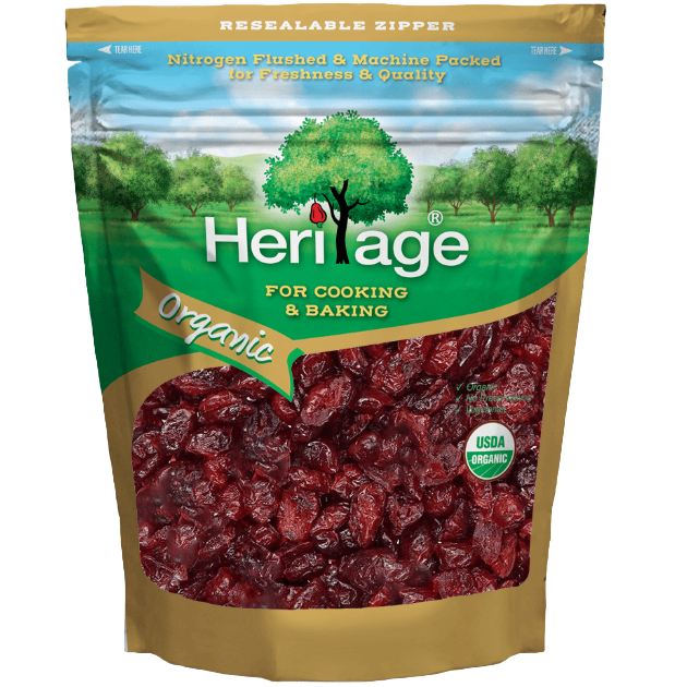 Heritage Organic Dried Cranberries in a clear bowl, showcasing vibrant red, chewy, natural confectionery snack.
