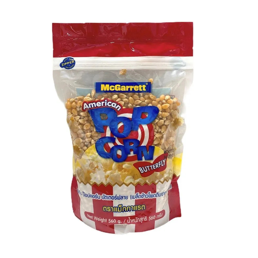 Mcgarrett Corn Kernels 560g in a clear plastic bag, showing bright yellow dry corn kernels for cooking or snacking.