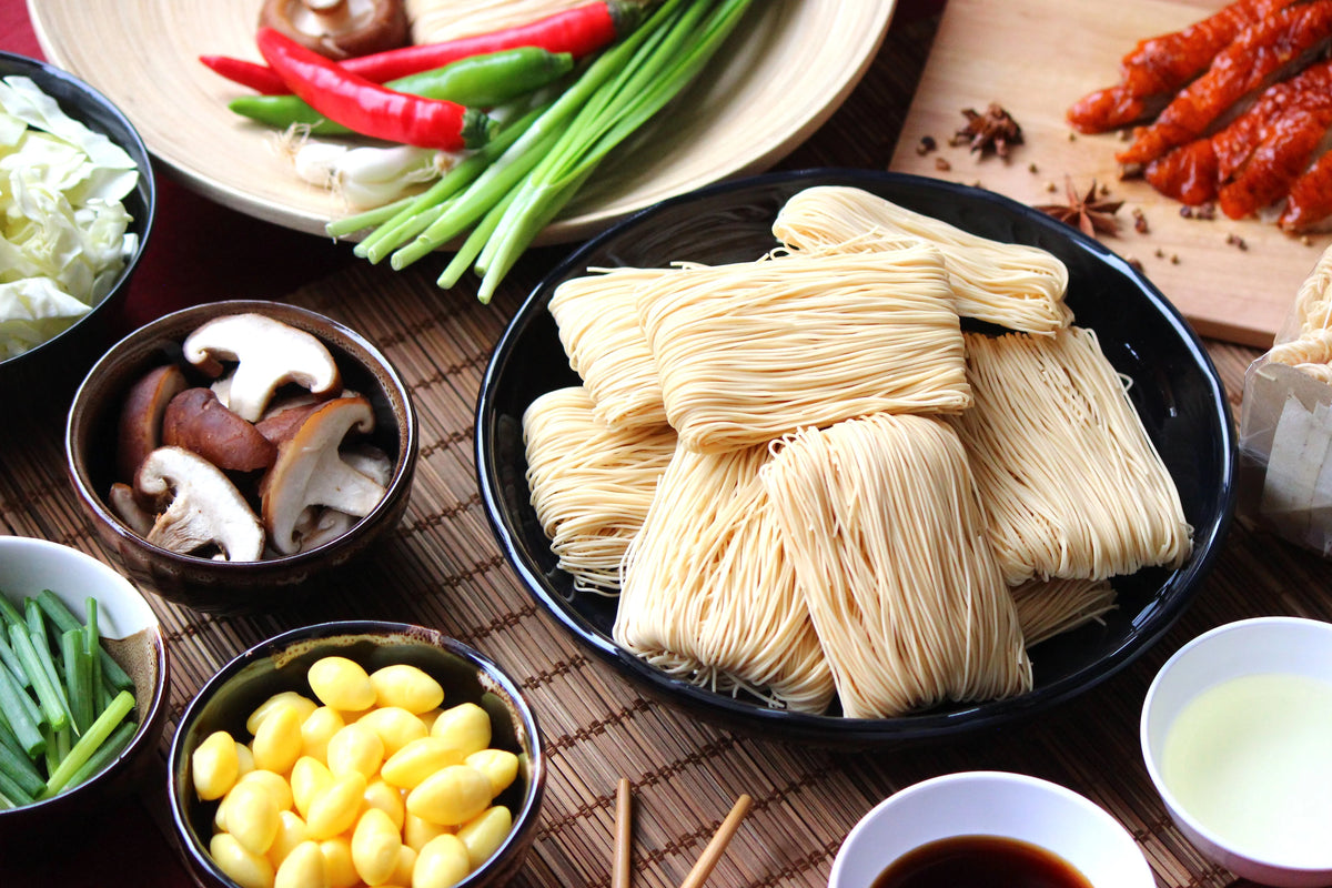 Rabbit Brand Hong Kong Style Noodles 1kg dry grocery package with uncooked noodles in a clear plastic bag.